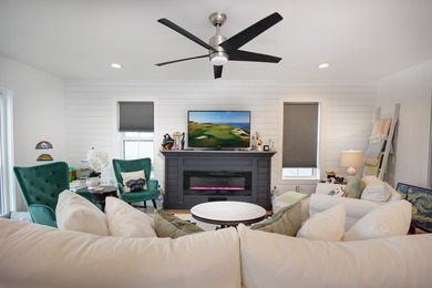 Tucked along the peaceful waters of Chincoteague Bay, this on Captains Cove Golf and Yacht Club in Virginia - for sale on GolfHomes.com, golf home, golf lot