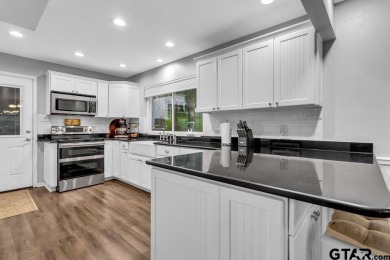 Welcome to your dream home in the serene community of Hideaway on Hide-A-Way Lake Golf Course in Texas - for sale on GolfHomes.com, golf home, golf lot