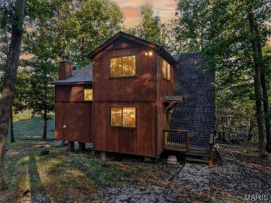 Welcome to 1746 Sonnenblick Drive -- a stunning chalet retreat on Innsbrook Resort Golf Course in Missouri - for sale on GolfHomes.com, golf home, golf lot
