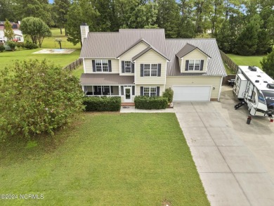 Welcome to this beautifully maintained 4-bedroom, 2.5-bath home on Rock Creek Country Club in North Carolina - for sale on GolfHomes.com, golf home, golf lot