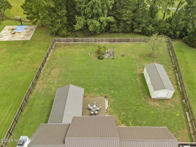 Welcome to this beautifully maintained 4-bedroom, 2.5-bath home on Rock Creek Country Club in North Carolina - for sale on GolfHomes.com, golf home, golf lot