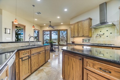 Offered for sale for the first time, this custom single story on Palmer Lakeside At Barton Creek in Texas - for sale on GolfHomes.com, golf home, golf lot