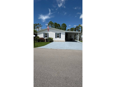 This move-in-ready gem has 2 bedrooms, 2 baths, and is located on Sabal Springs Golf and Racquet Club in Florida - for sale on GolfHomes.com, golf home, golf lot