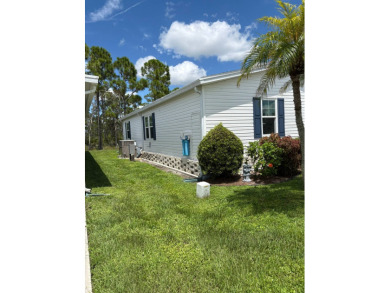 This move-in-ready gem has 2 bedrooms, 2 baths, and is located on Sabal Springs Golf and Racquet Club in Florida - for sale on GolfHomes.com, golf home, golf lot