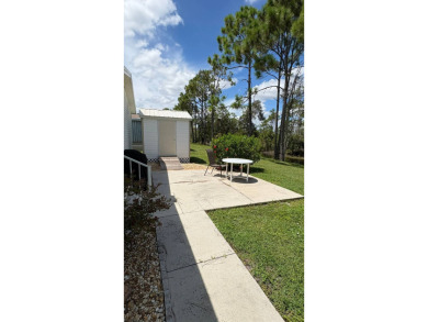 This move-in-ready gem has 2 bedrooms, 2 baths, and is located on Sabal Springs Golf and Racquet Club in Florida - for sale on GolfHomes.com, golf home, golf lot
