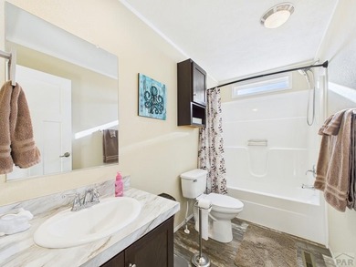 This well-maintained 3-bedroom, 2-bathroom manufactured home on Hollydot Golf Course in Colorado - for sale on GolfHomes.com, golf home, golf lot