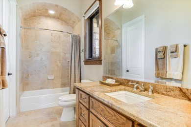 Offered for sale for the first time, this custom single story on Palmer Lakeside At Barton Creek in Texas - for sale on GolfHomes.com, golf home, golf lot