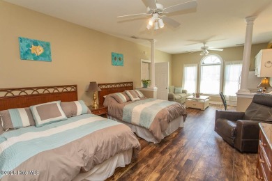 Incredibly well-maintained top floor condo overlooking the golf on Sea Trail Golf Resort in North Carolina - for sale on GolfHomes.com, golf home, golf lot