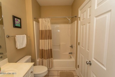 Incredibly well-maintained top floor condo overlooking the golf on Sea Trail Golf Resort in North Carolina - for sale on GolfHomes.com, golf home, golf lot