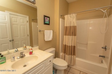 Incredibly well-maintained top floor condo overlooking the golf on Sea Trail Golf Resort in North Carolina - for sale on GolfHomes.com, golf home, golf lot
