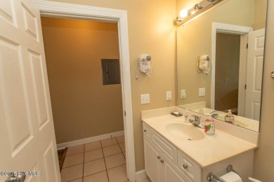 Incredibly well-maintained top floor condo overlooking the golf on Sea Trail Golf Resort in North Carolina - for sale on GolfHomes.com, golf home, golf lot