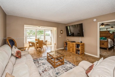Step into the tranquility of this furnished 2 bedroom, 2 on Oriole Golf and Tennis Club in Florida - for sale on GolfHomes.com, golf home, golf lot