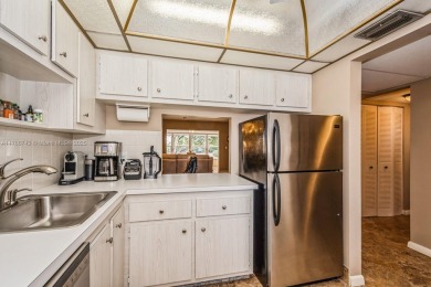 Step into the tranquility of this furnished 2 bedroom, 2 on Oriole Golf and Tennis Club in Florida - for sale on GolfHomes.com, golf home, golf lot