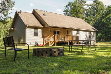 This beautifully designed home offers the perfect blend of on Michaywe Pines Course in Michigan - for sale on GolfHomes.com, golf home, golf lot