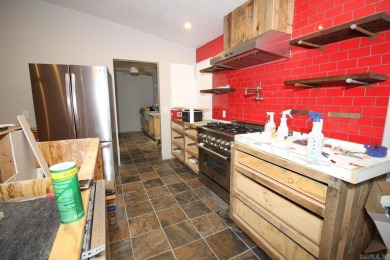 Remodel has been started leaving it up to a new buyer to on Cortez Golf Course in Arkansas - for sale on GolfHomes.com, golf home, golf lot