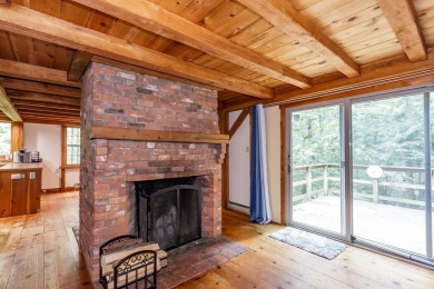 Tucked at the end of a quiet cul-de-sac, this post-and-beam cape on Eastman Golf Links in New Hampshire - for sale on GolfHomes.com, golf home, golf lot