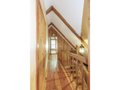 Tucked at the end of a quiet cul-de-sac, this post-and-beam cape on Eastman Golf Links in New Hampshire - for sale on GolfHomes.com, golf home, golf lot