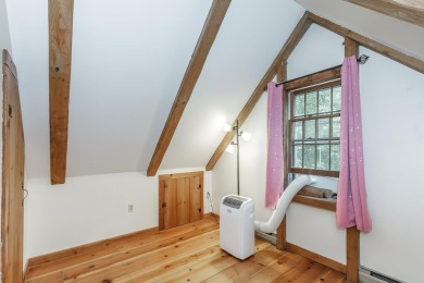 Tucked at the end of a quiet cul-de-sac, this post-and-beam cape on Eastman Golf Links in New Hampshire - for sale on GolfHomes.com, golf home, golf lot