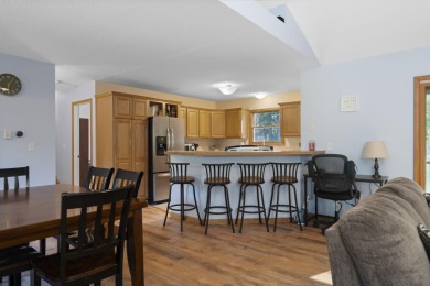 This beautifully designed home offers the perfect blend of on Michaywe Pines Course in Michigan - for sale on GolfHomes.com, golf home, golf lot