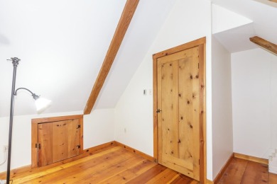 Tucked at the end of a quiet cul-de-sac, this post-and-beam cape on Eastman Golf Links in New Hampshire - for sale on GolfHomes.com, golf home, golf lot