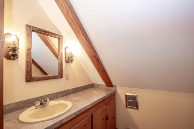 Tucked at the end of a quiet cul-de-sac, this post-and-beam cape on Eastman Golf Links in New Hampshire - for sale on GolfHomes.com, golf home, golf lot