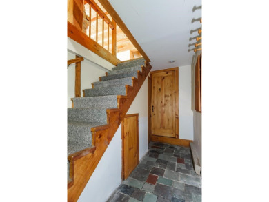 Tucked at the end of a quiet cul-de-sac, this post-and-beam cape on Eastman Golf Links in New Hampshire - for sale on GolfHomes.com, golf home, golf lot