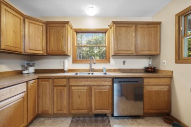 This beautifully designed home offers the perfect blend of on Michaywe Pines Course in Michigan - for sale on GolfHomes.com, golf home, golf lot