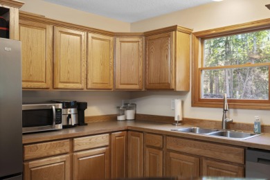 This beautifully designed home offers the perfect blend of on Michaywe Pines Course in Michigan - for sale on GolfHomes.com, golf home, golf lot