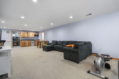 This beautifully designed home offers the perfect blend of on Michaywe Pines Course in Michigan - for sale on GolfHomes.com, golf home, golf lot