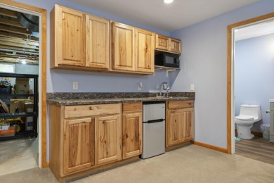 This beautifully designed home offers the perfect blend of on Michaywe Pines Course in Michigan - for sale on GolfHomes.com, golf home, golf lot