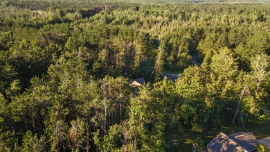 This beautifully designed home offers the perfect blend of on Michaywe Pines Course in Michigan - for sale on GolfHomes.com, golf home, golf lot