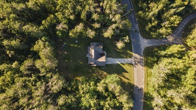 This beautifully designed home offers the perfect blend of on Michaywe Pines Course in Michigan - for sale on GolfHomes.com, golf home, golf lot