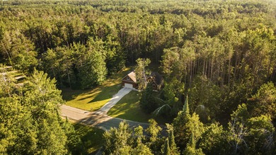 This beautifully designed home offers the perfect blend of on Michaywe Pines Course in Michigan - for sale on GolfHomes.com, golf home, golf lot