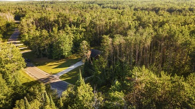 This beautifully designed home offers the perfect blend of on Michaywe Pines Course in Michigan - for sale on GolfHomes.com, golf home, golf lot