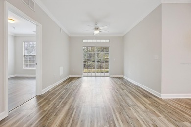 Enjoy vacationing, or living in this first floor condo that on ChampionsGate Golf Resort in Florida - for sale on GolfHomes.com, golf home, golf lot