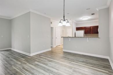 Enjoy vacationing, or living in this first floor condo that on ChampionsGate Golf Resort in Florida - for sale on GolfHomes.com, golf home, golf lot