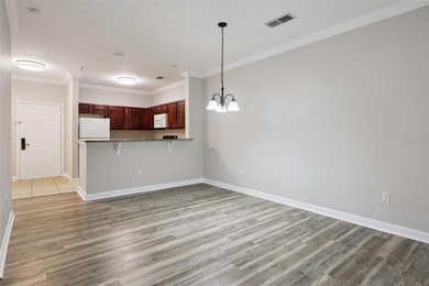 Enjoy vacationing, or living in this first floor condo that on ChampionsGate Golf Resort in Florida - for sale on GolfHomes.com, golf home, golf lot