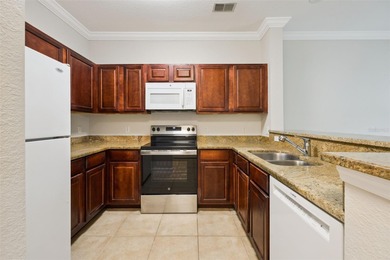 Enjoy vacationing, or living in this first floor condo that on ChampionsGate Golf Resort in Florida - for sale on GolfHomes.com, golf home, golf lot