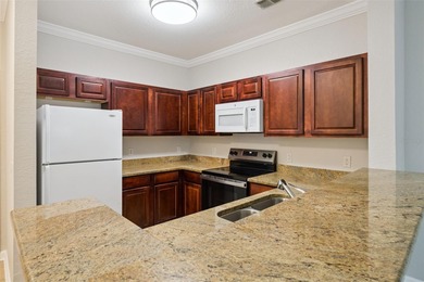 Enjoy vacationing, or living in this first floor condo that on ChampionsGate Golf Resort in Florida - for sale on GolfHomes.com, golf home, golf lot