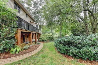 Nestled on a quiet cul-de-sac street just steps from the on Country Club of Roswell in Georgia - for sale on GolfHomes.com, golf home, golf lot