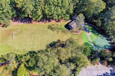 Nestled on a quiet cul-de-sac street just steps from the on Country Club of Roswell in Georgia - for sale on GolfHomes.com, golf home, golf lot