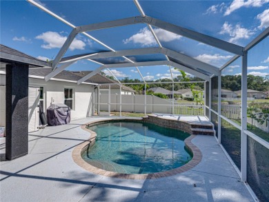 Step into modern comfort and style with this stunning 4-bedroom on Lexington Oaks Golf Club in Florida - for sale on GolfHomes.com, golf home, golf lot