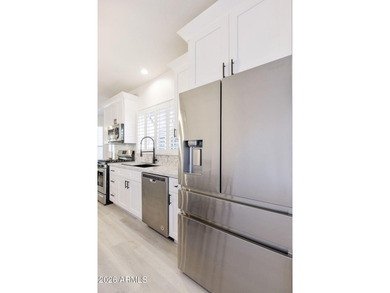 Resort-style living with stunning LAKE, GOLF course, and on Oakwood Golf Club  in Arizona - for sale on GolfHomes.com, golf home, golf lot