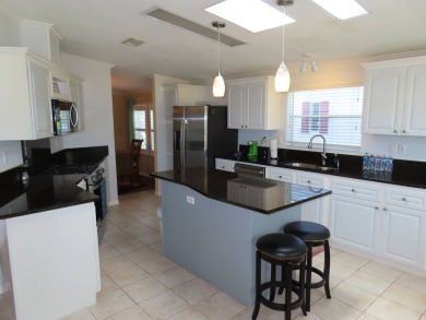 This huge 2272 sf 3/2 home under air, is located on the 7th Tee on Crane Lakes Golf and Country Club in Florida - for sale on GolfHomes.com, golf home, golf lot