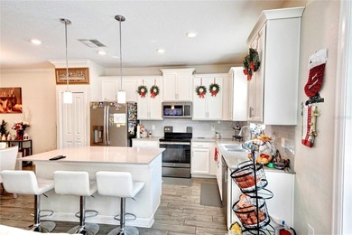 This beautifully maintained 3-bedroom, 2.5-bathroom townhome on ChampionsGate Golf Resort in Florida - for sale on GolfHomes.com, golf home, golf lot