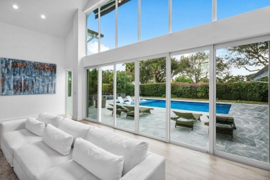 Step into a world where contemporary design and timeless on Bocaire Country Club in Florida - for sale on GolfHomes.com, golf home, golf lot