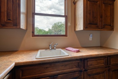 Open Sat 11-2, Sun 1-3. Discover unparalleled luxury in this on Paa-Ko Ridge Golf Club  in New Mexico - for sale on GolfHomes.com, golf home, golf lot