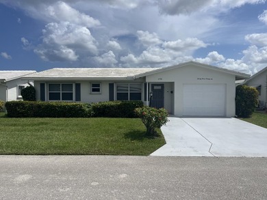 Beautifully updated and modern 2br/2ba home in Leisureville with on Leisureville Community Golf Course in Florida - for sale on GolfHomes.com, golf home, golf lot