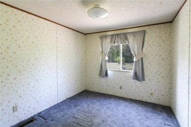 Well-kept and updated 3 bed/2 bath manufactured home on nearly on Moose Lake Golf Club in Minnesota - for sale on GolfHomes.com, golf home, golf lot