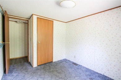 Well-kept and updated 3 bed/2 bath manufactured home on nearly on Moose Lake Golf Club in Minnesota - for sale on GolfHomes.com, golf home, golf lot